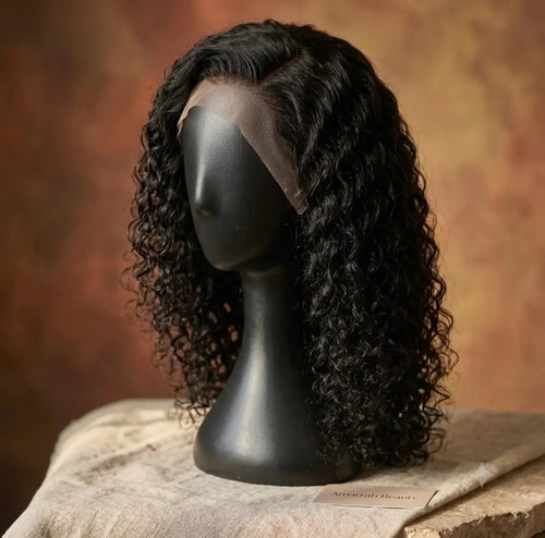 10 inch Deep Wave Curly Bob Wig on black mannequin head, curly front view, warm terracotta background — Amarrah Beauty